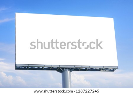 Billboard - Large Blank Billboard with empty screen and beautiful cloudy sky for outdoor advertising poster,Copy space banner ready for your advertisement design or mock up text.Business Concept. Royalty-Free Stock Photo #1287227245