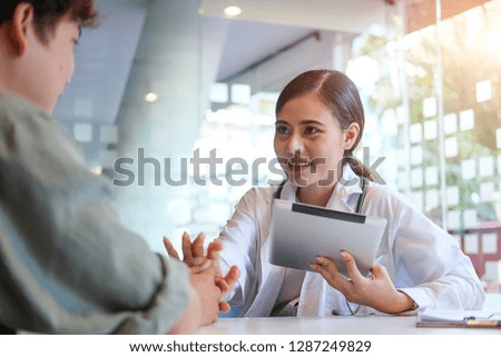 Healthcare technology concept.Woman Doctor Working using a laptop computer contact with patient. 