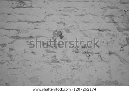 Old brick wall. Cracked and scratched texture. Grunge background