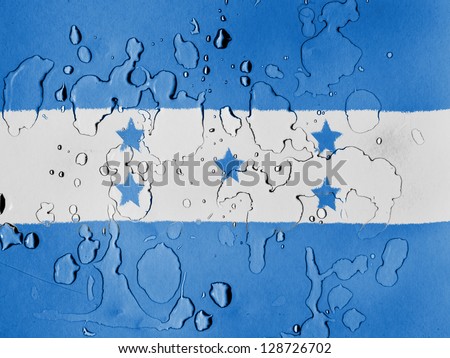 Honduras. Honduran flag covered with water drops