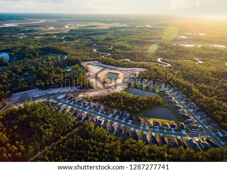Aerial view of community surrounded by lots of vegetation and swamps in Yulee Florida.