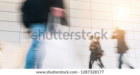 crowd of people walking on a trade show