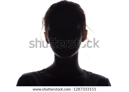 silhouette of a beautiful girl confidently looking forward, a young woman's head with a curl on a white isolated background