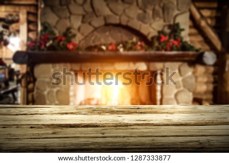 Table background of free space for your decoration and fireplace background. 