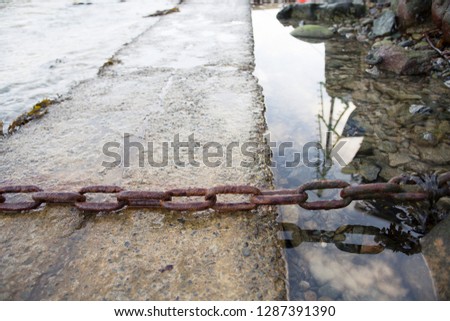 A series of images from the fishing village of Mousehole, in Cornwall. Photos taken on a clear winter's day, featuring old, rusty fishing chains and moorings. 