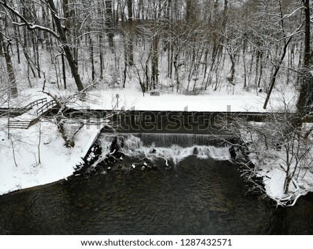 The aerial view of the waterfall in Brandywine Park after a snowstorm in Wilmington, Delaware, U.S.A
