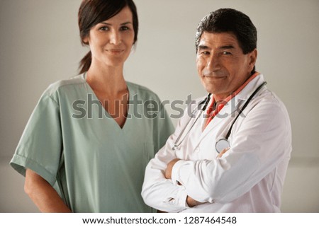 Portrait of male doctor and female nurse.