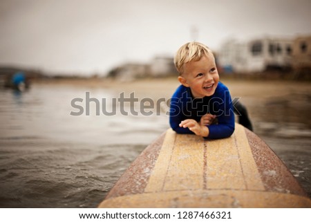 Little boy on surfboard