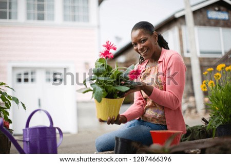 Woman happily gardening