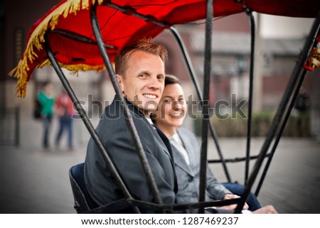 Couple sitting in rickshaw