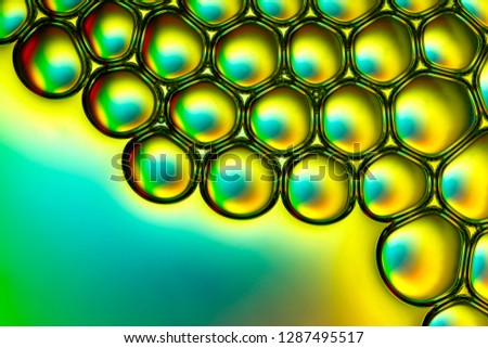 Colorful soap bubbles in water.