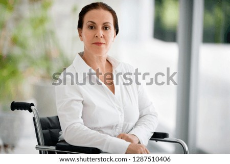Portrait of senior woman in a wheelchair.