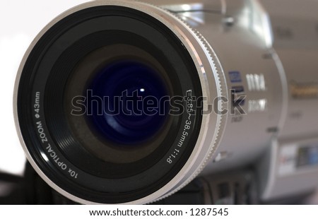 Close up of digital video camera over white background