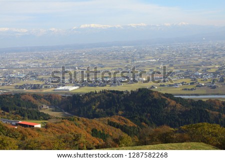 A picture of a landscape with mountains and blue sky in the background