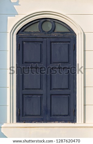 Large blue wooden window. The old vintage retro window made of hardwood.  
