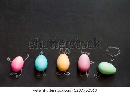 Easter  funny painting  eggs on blackboard abstract children's background