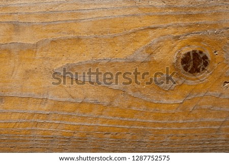 Closeup of wood floors With beautiful patterns Saw dark brown wood eyes Golden brown wood With clear lines and with cracks of wood