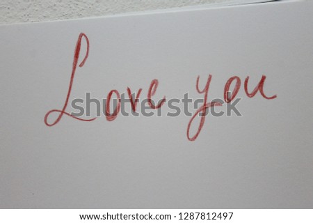 Love you word wrote with red pencil color.