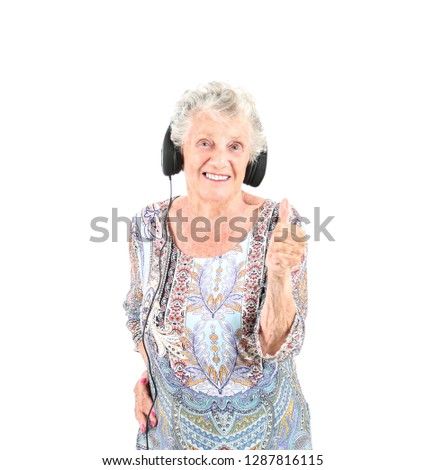 Happy old woman doing a thumb up gesture with her hand against a white background