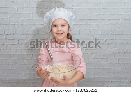 the girl cook baby cooking in the kitchen baking