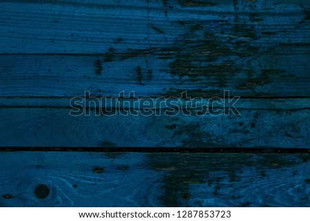 bright art texture of blue wooden boards close up old and tattered grunge background for design