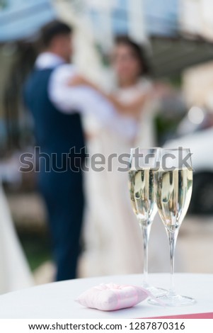 two glasses of champagne for the newlyweds on the table