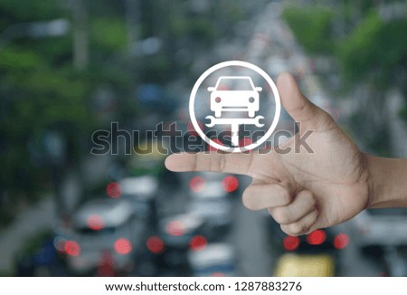 Hand pressing service fix car with wrench tool flat icon over blur of rush hour with cars in city road, Business repair car concept