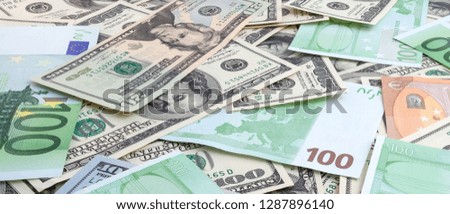 Panorama of US dollars and euro banknotes texture. Texture US dollars and euro.  Background of one hundred dollar and eur bills. 