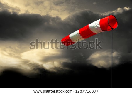 Windsock with Cloudy Sky Royalty-Free Stock Photo #1287916897