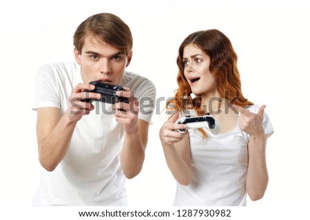 Young people with controllers from the console                        
