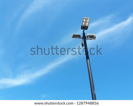 power poles against cloudy sky