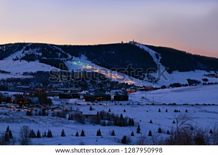 Beautiful view of the snowy mountains. Panorama of the Germany ski resort. Winter sport, ski slopes by night.