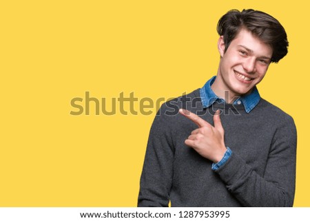Young handsome elegant man over isolated background cheerful with a smile of face pointing with hand and finger up to the side with happy and natural expression on face