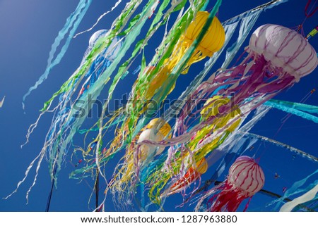 Colorful ribbons on blue sky background pattern