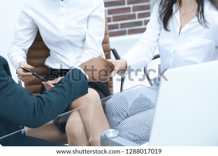 handshake of business partners in a modern office.