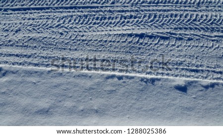 Snow. Trail on the snow. Car track on snow surface