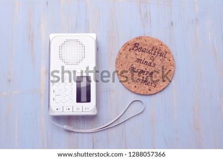 White radio on wooden background