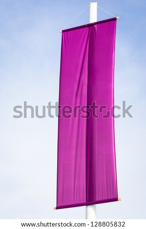 purple flag in front of blue sky