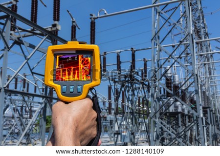 Thermoscan(thermal image camera), Industrial equipment used for checking the internal temperature of the machine for preventive maintenance, This is checking The High voltage Connector. Royalty-Free Stock Photo #1288140109