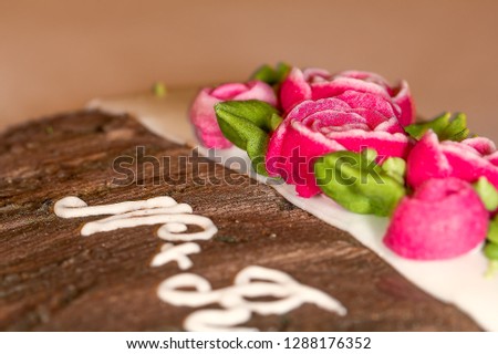 gingerbread heart with small roses, and initial of names on the sweet 