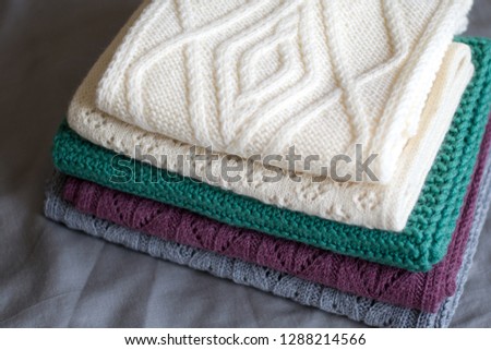 Stacked knitted scarves 