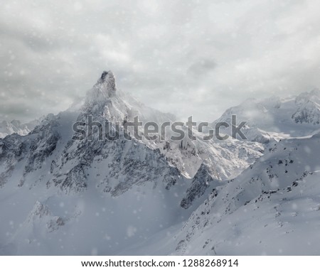 Snowstorm above the Aiguille du fruit, a famous mountain among the Alps - Courchevel, France
