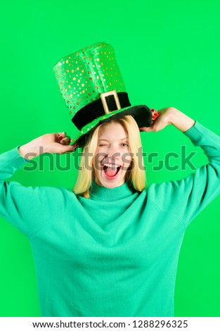 Saint Patrick's Day. Happy girl in green hat celebrate Patricks Day. Leprechaun. Smiling girl. Isolated.