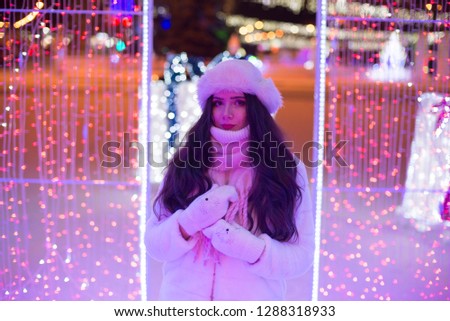 girl in the winter in a garland