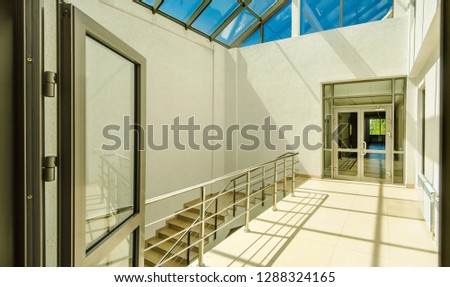 Beautiful and original panorama. Beautiful background and view of the covered veranda and open space with stained-glass windows on the ceiling in sunny weather against a blue sky with clouds.