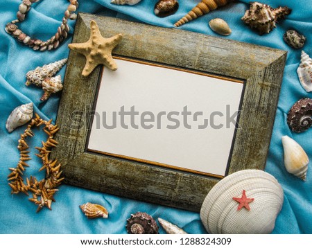 Romantic message concept, photo frame decorated with shells
