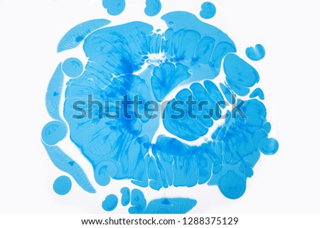 Abstract blue drops on the white background. View of macro world through the microscope.