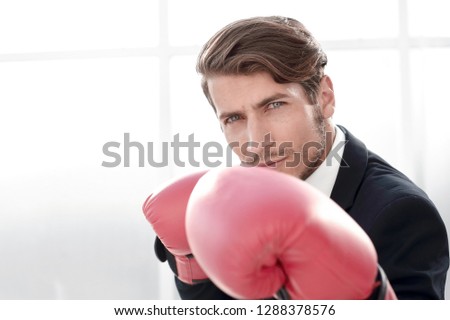 close up.competitive businessman in Boxing gloves