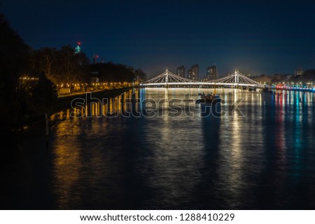 Battersea park and Albert bridge in the night, London