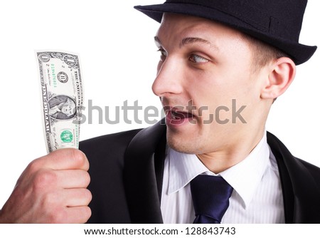 Businessman hold dollar in  hand.May be it is his lucky ticket.